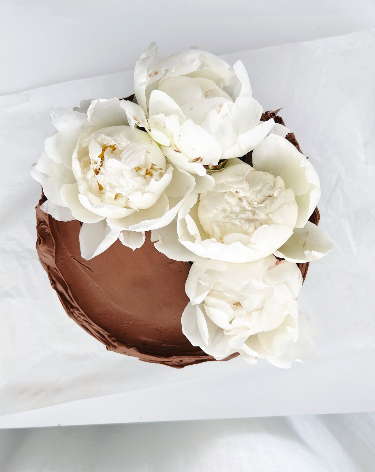 chocolate cake decorated with peonies