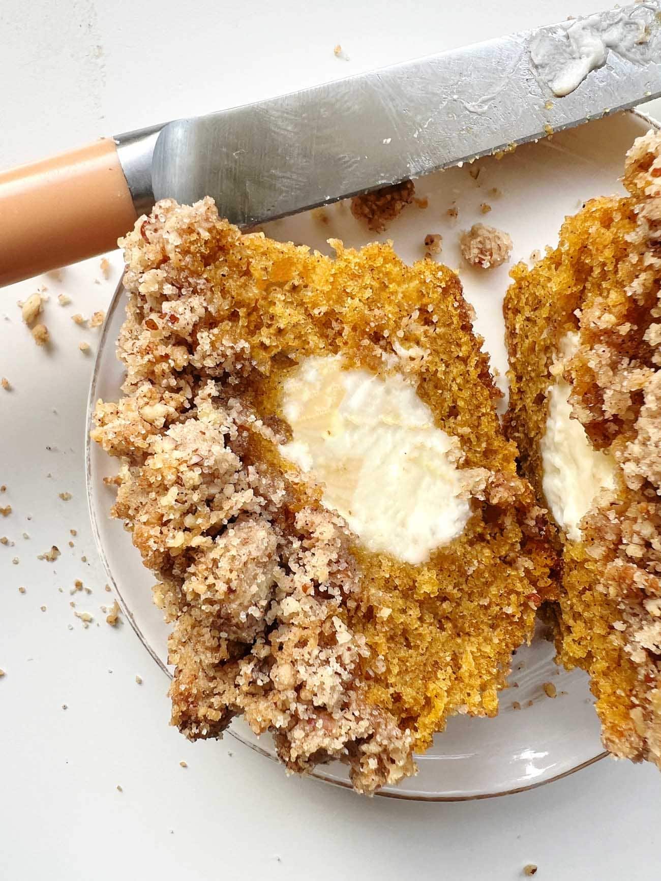 cream cheese pumpkin streusel muffin cut in half