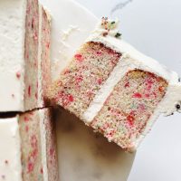 slices of confetti cake on cake stand