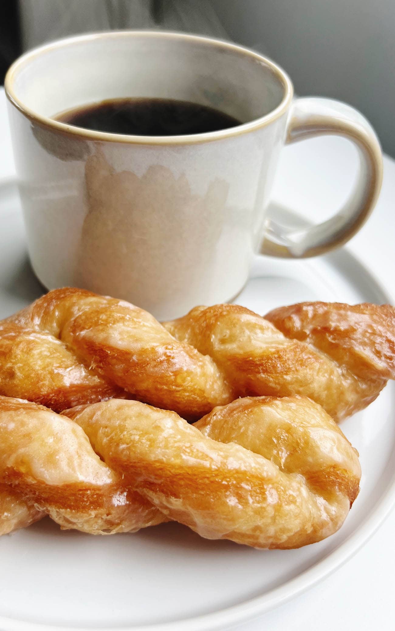 homemade croissant twists with cup of coffee
