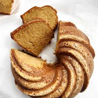 toasted sesame bundt cake on white parchment paper