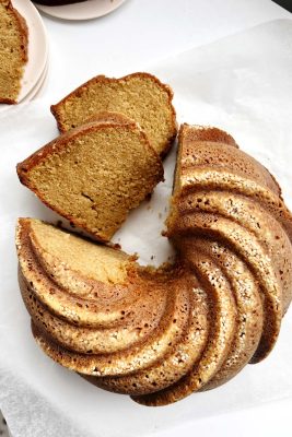 toasted sesame bundt cake on white parchment paper