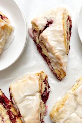 raspberry scones on parchment paper