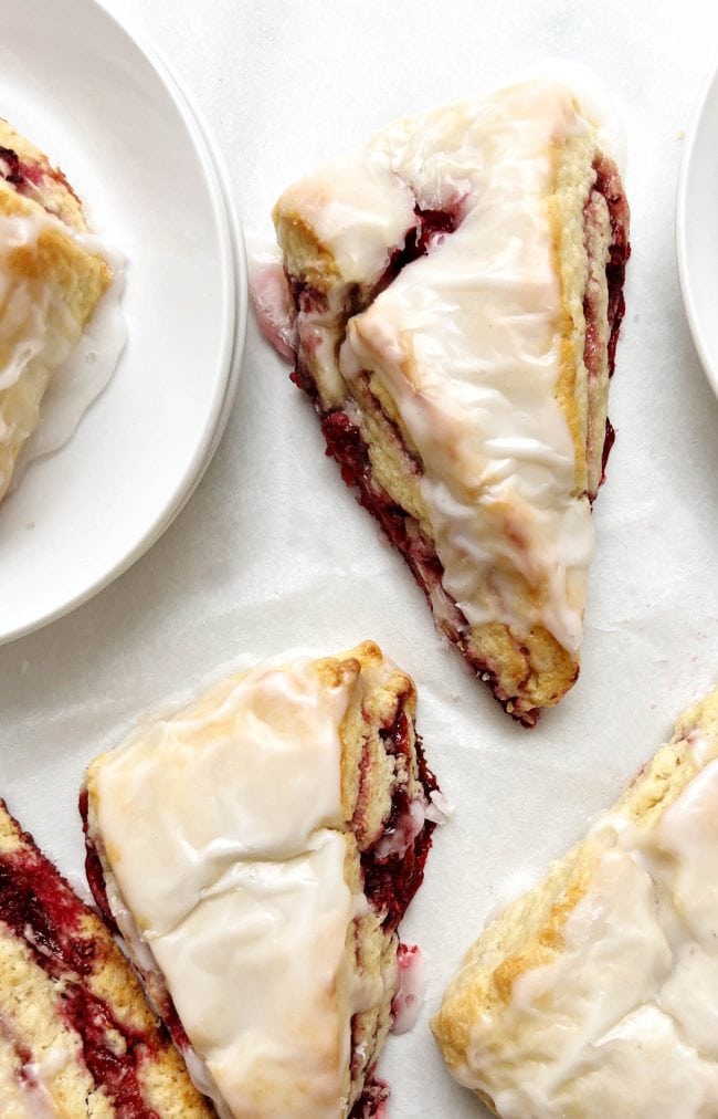 raspberry scones on parchment paper