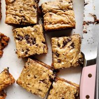 Scotcharoo blondie bars cut with a pink knife