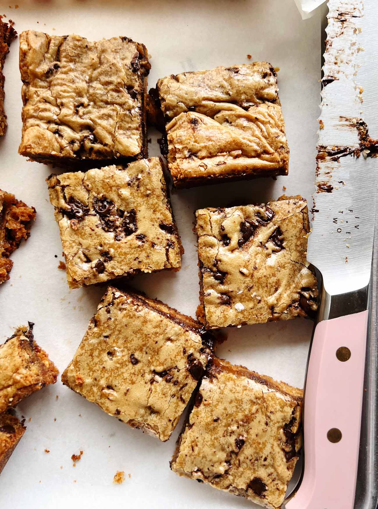 Scotcharoo blondie bars cut with a pink knife