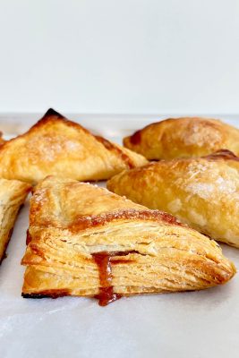 puff pastry apple turnovers on parchment