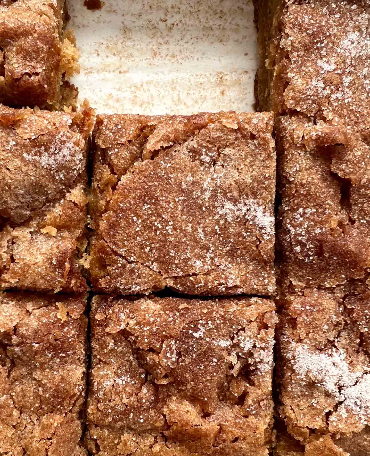 apple cake in a pan, slices cut