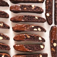 Chocolate dipped chocolate biscotti on baking tray