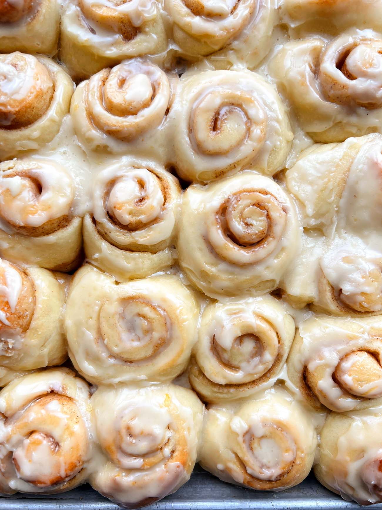 mini orange cinnamon rolls in a pan