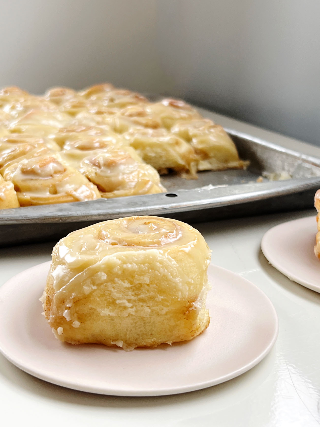 mini cinnamon roll on a pink plate