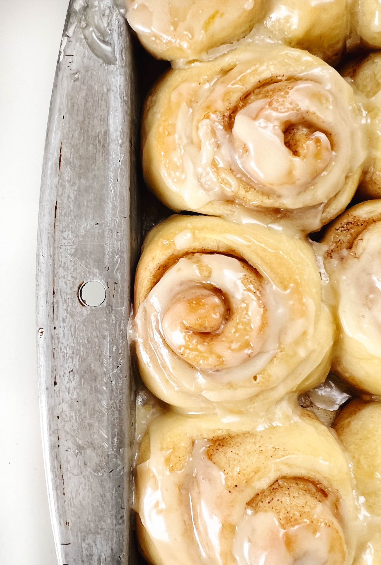 mini orange cinnamon rolls in a pan