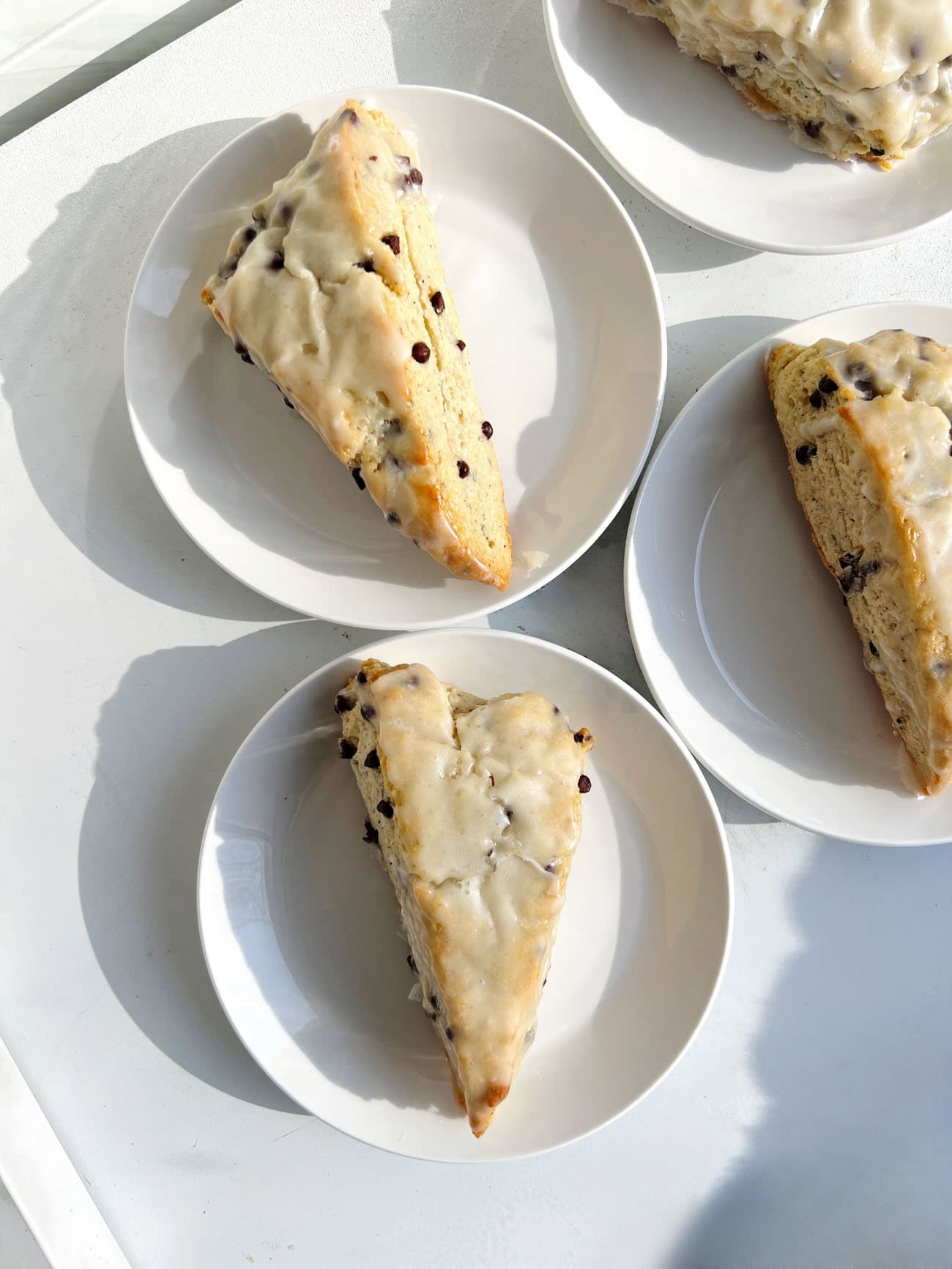 chocolate chip scones on white plates