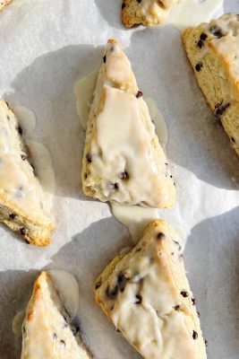 chocolate chip scones on white parchment paper