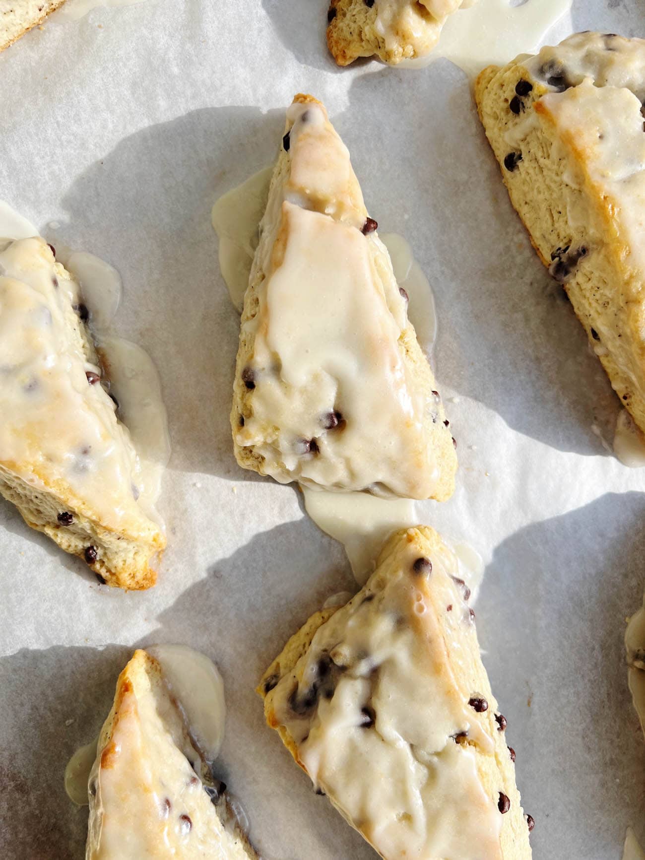 chocolate chip scones on white parchment paper